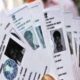 two voter cards made on one face warning of action received from speed post