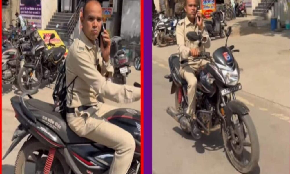 Policeman was driving while talking on the phone video went viral fined Rs 1000